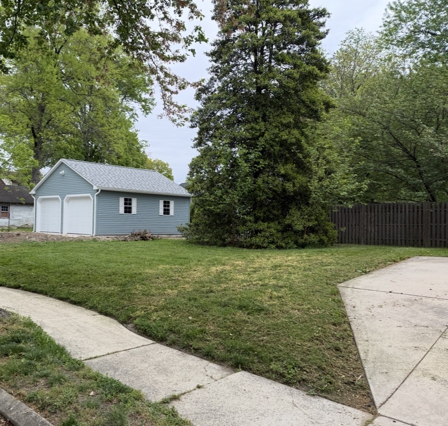 Green lawn with garage